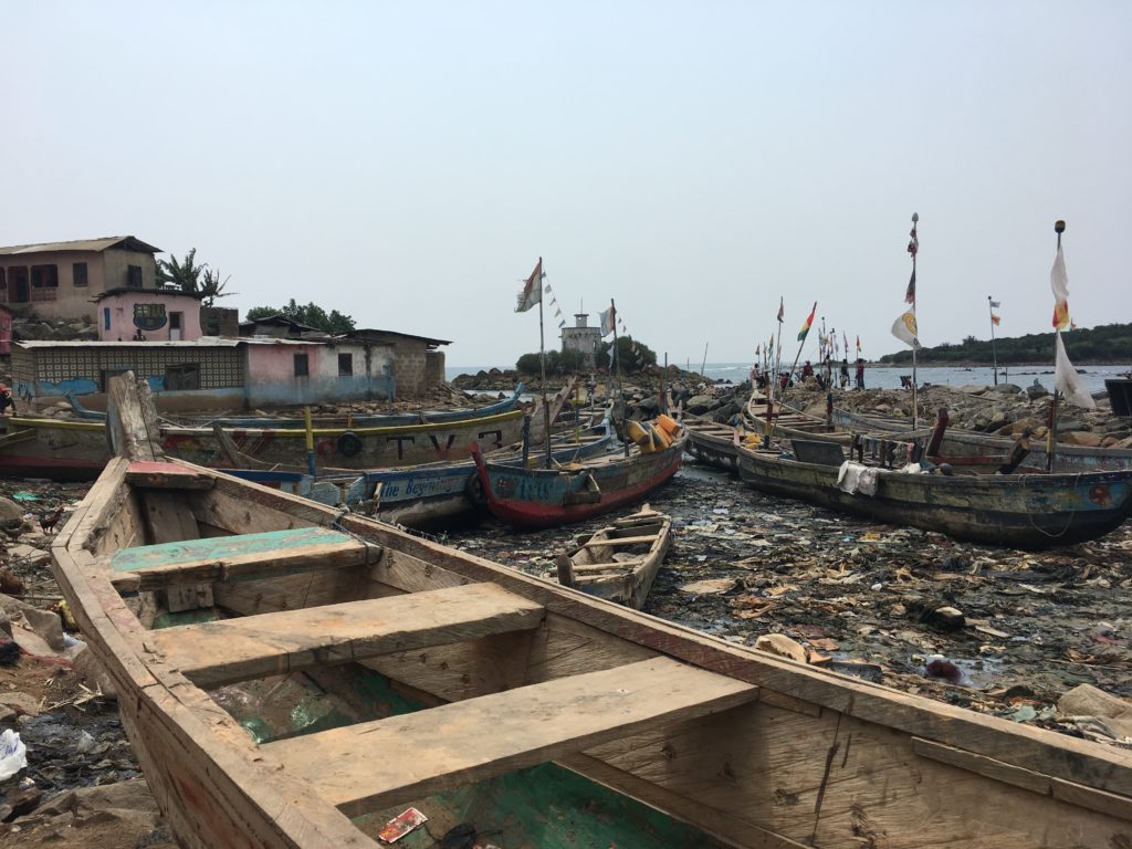 Fishing boats at bay among the rubbish in Dixcove
