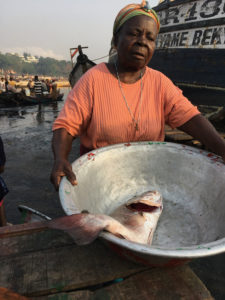 One fish seller shows off her stock at Sekondi fish market